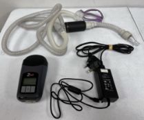 A pre-owned Breas Z2 Auto Travel CPAP Machine (REF: 718116) with tubing and UK power adaptor in stor