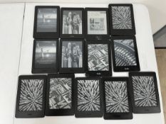 Twelve pre-owned Amazon Kidle E-Readers (Various models, grades C-F) (Sold as seen).
