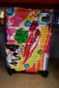 An Away Bigger Carry On Case in a psychedelic design.