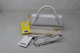 A pre-owned Jacquemus Le Chiquito Long in White (Overall Good Condition, Few Red Marks Inside).