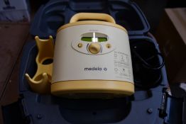 A Medela Symphony double breast pump (Unit only).