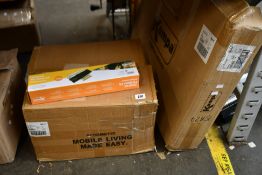 Twenty Kampa Universal tie-down kits and four Kampa Duplex plastic tables, all boxed as new.