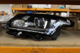 A pre-owned Range Rover Evoque L405 Genuine Left Xenon headlight (CK52-13W030-DD).