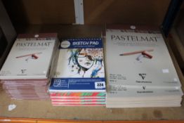 Twenty two Clairefontaine Pastelmats (15 x 18 x 24cm and 7 x 30 x 40cm) along with four Faber-