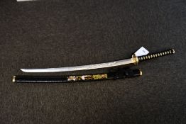 A Japanese style replica sword with dragon design engraving on blade (Over 18s only).