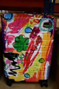 An Away Bigger Carry On Case in a psychedelic design.