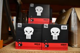 Thirteen pairs of boxed Marvel Punisher C22 headphones.
