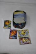 A Tin of Pokemon TCG Playing Cards.