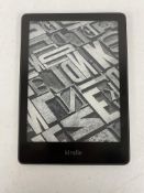 A pre-owned Amazon Kindle Paperwhite 11th Gen E-Reader (M/N: M2L3EK) (Grade B).
