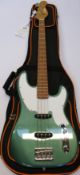An as new Tribe Shob Teal Green Bass Guitar with gig bag.