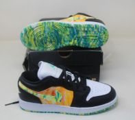 A pair of Nike Air Jordan 1 Low SE (GS) - Black/White-Team Orange (UK 5.5, box damaged).