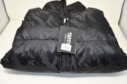 An as new Trapstar T Jacquard Puffer Coat in Black (Size L).