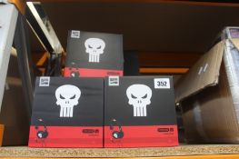Thirteen pairs of boxed Marvel Punisher C22 headphones.