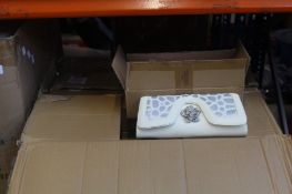 A box of Yippy Dada clutch bags (Approximately 35 items).