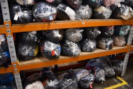 Thirty bags of pre-owned clothing and related items.