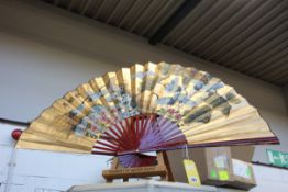 A large Gilded Fan with a Japanese Crane Design.