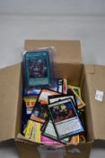 A mixed box of assorted Pokémon, Magic The Gathering, Yu-Gi-Oh!, Basketball and Football Trading