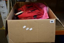 Seven Petit Planet urbane bags in red.