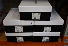 Five pairs of boxed as new Kurt Geiger London Laney Eagle Slip-On Studded Trainers in black (EU