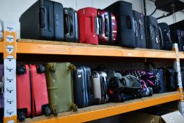 A large quantity of pre-owned suitcases and related (Approximately 40 items).