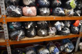 Thirty bags of pre-owned clothing and related items.