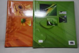 Eight Hama photo albums (4x green and 4x orange).