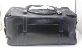 An Aston Martin AM6 Vantage Leather Holdall in black and blue (708402).