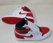 A pair of Nike Air Jordan 1 Heritage trainers with extra laces (UK 8) (Requires cleaning) (No box).