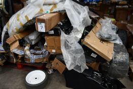 A quantity of automotive and related items to include tyres, steering rack and centre console.