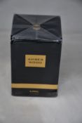 A boxed as new Amber Wood Ajmal eau de parfum (100ml) (Box has some minor damage).
