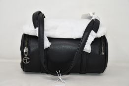 An as new Telfar Small Duffle Bag in black (TF-050-BK-S).