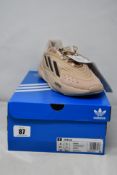 A pair of boxed as new Adidas Ozelia Sneakers in brown GX4029 (UK 7.5).