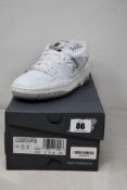 A pair of boxed as new New Balance 550 trainers in white (UK 5).