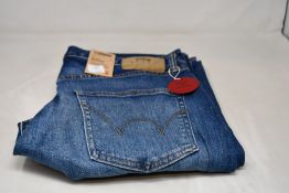 A pair of as new Edwin Regular Tapered Jeans (Size W34 L34).