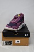 A pair of women's boxed as new Nike Jordan MA2 in Light Mulberry/Saturn Gold (UK 5).