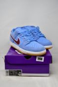 A pair of as new Nike SB Dunk Low PRM in Vapor Blue/Team Maroon (Size UK 10).