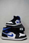 A pair of as new Nike Air Jordon 1 mid white/racer blue black (UK 10) (Slight damage to outer box).