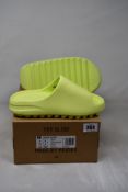 A pair of as new Yeezy Slides in Glwgrn (Size UK 6).