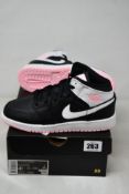 A pair of as new Air Jordan 1 Mid (GS) in Black/White-Artic Punch (Size UK 4).