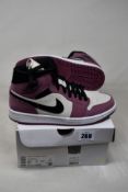 A pair of as new Nike Air Jordan 1 Mid SE in Light Mulberry/Black (Size UK 6).