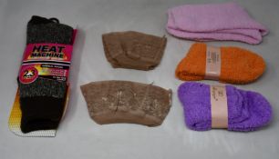 A mixed lot of women's socks and stocking; Includes twenty four fluffy lounge socks, seven pairs