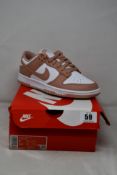 A pair of women's boxed as new Nike Dunk Low - White/Rose Whisper (UK 5.5, some minor damage to