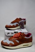 A pair of boxed as new Nike Air Max 1 Patta 'Waves' in Dark Russet (UK 9).