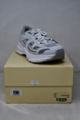 A pair of as new Axel Arigato Marathon R-Trail Trainers in White (Size UK 6).
