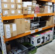A large quantity of assorted new and pre-owned electrical items and accessories (Three shelves of st