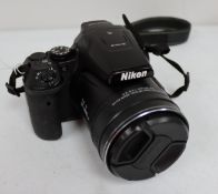 A pre-owned Nikon COOLPIX P900 16.0 MP 83x Optical Zoom Digital Camera (Battery included, no charger