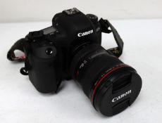 A pre-owned Canon EOS 6D Mark II Digital SLR Camera with a Canon EF 17-40mm f/4L USM Lens , three Ca