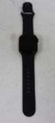 A pre-owned Apple Watch SE (GPS, 40 mm) 32GB in Space Gray with a Black Sport Band (iCloud account l