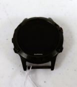 A pre-owned Garmin Fenix 5 Multisport GPS Watch in Black (No band included) (Grade C).
