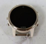A pre-owned Garmin Fenix 5s Multisport GPS Watch in Silver/White (No band included) (Grade C).